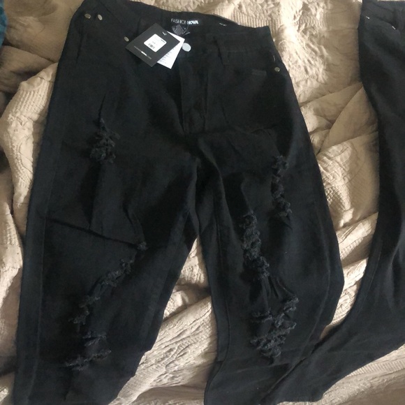 New never wore jeans. All black with little holes. - Picture 2 of 5